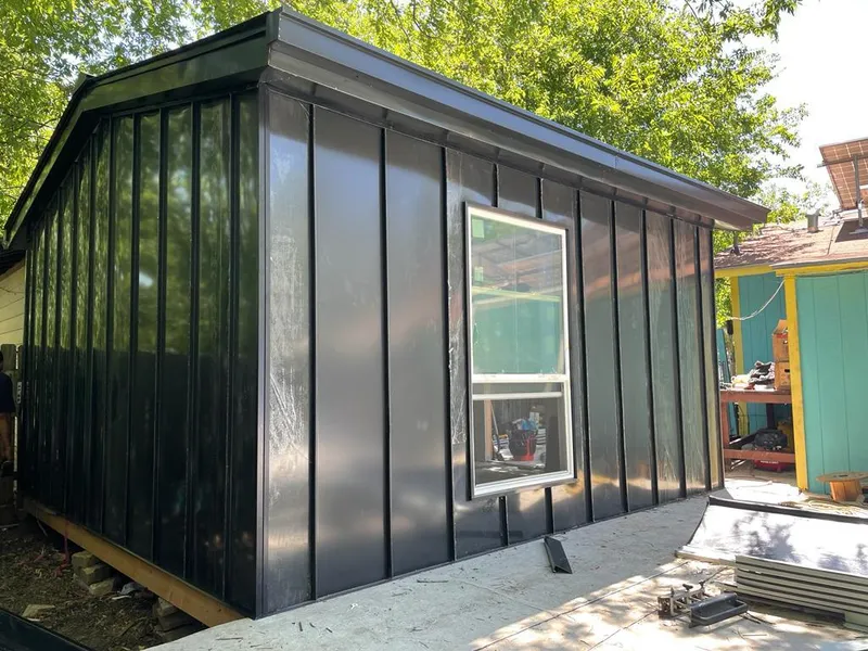 Black standing seam metal wall panels for Roof Inspection in Georges